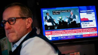 A trader works, as a screen broadcasts a live interview with U.S. Federal Reserve Chair Jerome Powell, on the floor at the New York Stock Exchange in New York City, U.S., April 16, 2025.