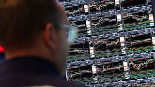 A trader works on the floor of the New York Stock Exchange (NYSE) at the opening bell in New York City, on April 17, 2025.