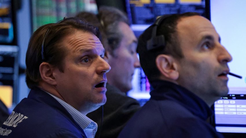 Traders work on the floor at the New York Stock Exchange on April 24, 2025.
