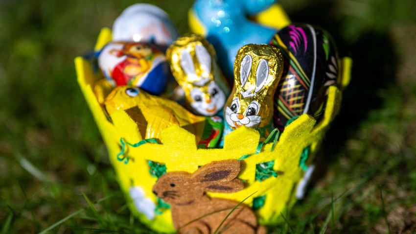 An Easter basket filled with chocolate figures and decorative eggs