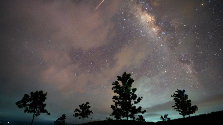 A flight-illuminated path and the Milky Way are appearing in the night sky during the Eta Aquarids meteor shower, which is peaking in Ratnapura, Sri Lanka, on May 5, 2024. The Eta Aquarids Meteor Shower is an annual event caused by Earth passing through debris left behind by Halley’s Comet. Named after the constellation Aquarius, these meteors are streaking across the sky at high speeds, creating a dazzling display of shooting stars. Best observed in the predawn hours away from city lights, it is a mesmerizing celestial event cherished by skywatchers worldwide. (Photo by Thilina Kaluthotage/NurPhoto via Getty Images)