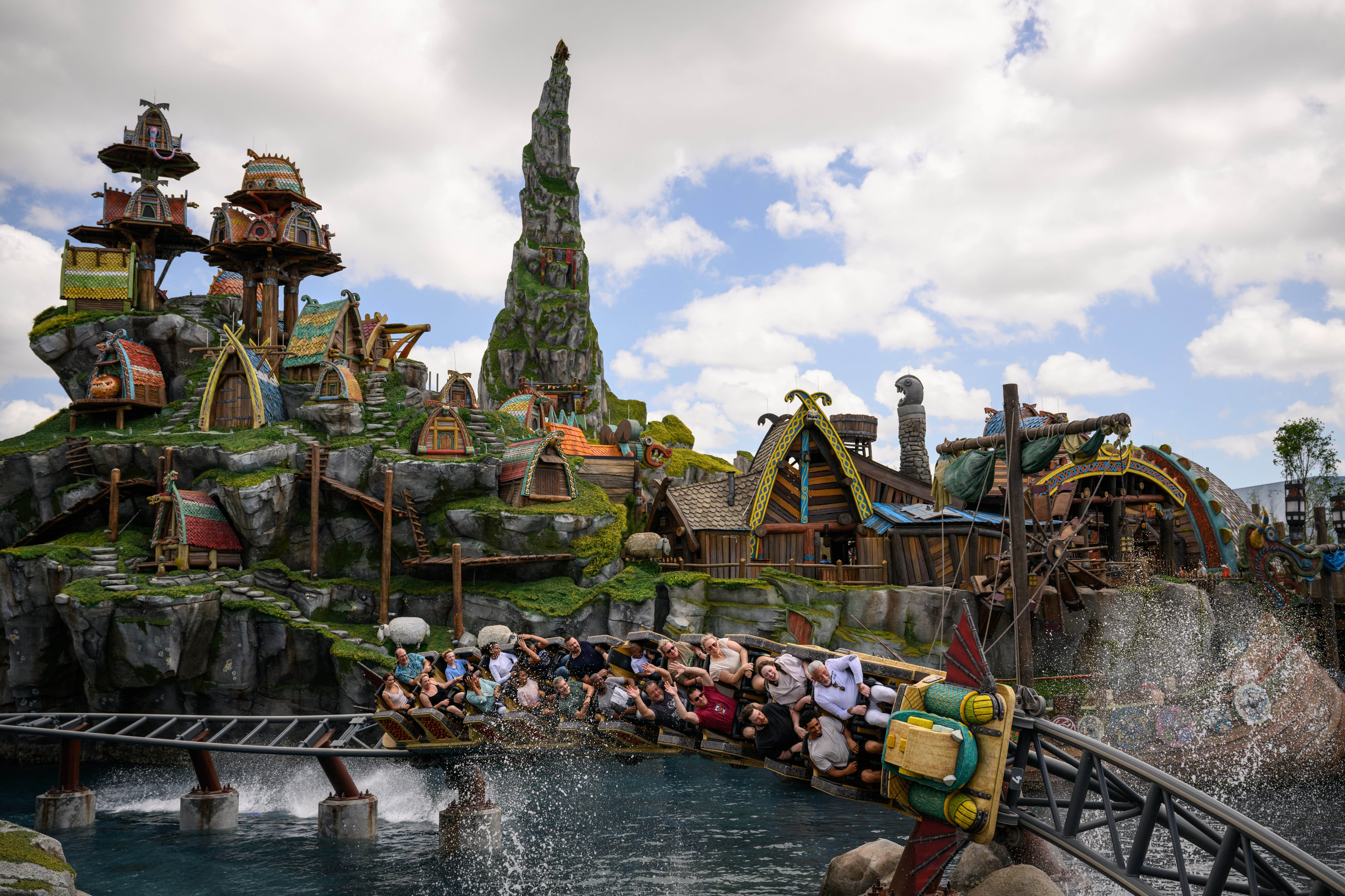 Guests ride the Hiccup's Wing Gliders rollercoaster