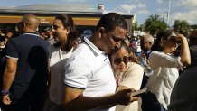 People gather near the site of a nightclub roof collapse in Santo Domingo, the Dominican Republic, on April 8, 2025. At least 27 people were killed Tuesday when the roof of the Jet Set nightclub collapsed in Santo Domingo, authorities confirmed. (Photo by Str/Xinhua via Getty Images)