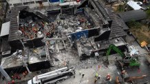 TOPSHOT - Aerial view shows rescue teams working at the Jet Set nightclub a day after the collapse of its roof in Santo Domingo on April 9, 2025. Rescuers raced to find survivors among the rubble of the nightclub where at least 124 people, including a former Major League Baseball star, were killed when the roof collapsed. (Photo by Alfred DAVIES / AFP) (Photo by ALFRED DAVIES/AFP via Getty Images)