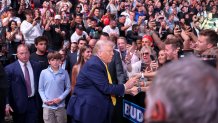 MIAMI, FLORIDA - APRIL 12: U.S. President Donald Trump arrives to watch the Ultimate Fighting Championship (UFC) at the Kaseya Center on April 12, 2025 in Miami, Florida. The Trump administration issued a rule late Friday that spared smartphones, computers, semiconductors, and other electronics from some of the tariffs they have enacted. (Photo by Joe Raedle/Getty Images)