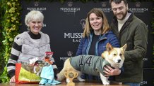 Winner of the Corgi Derby, Juno with his owners Fran Brandon and Alisdair Tew, is presented a trophy from Judy Murray at Musselburgh Racecourse, East Lothian, as part of its Easter Saturday race day celebration. Picture date: Saturday April 19, 2025. (Photo by Lesley Martin/PA Images via Getty Images)
