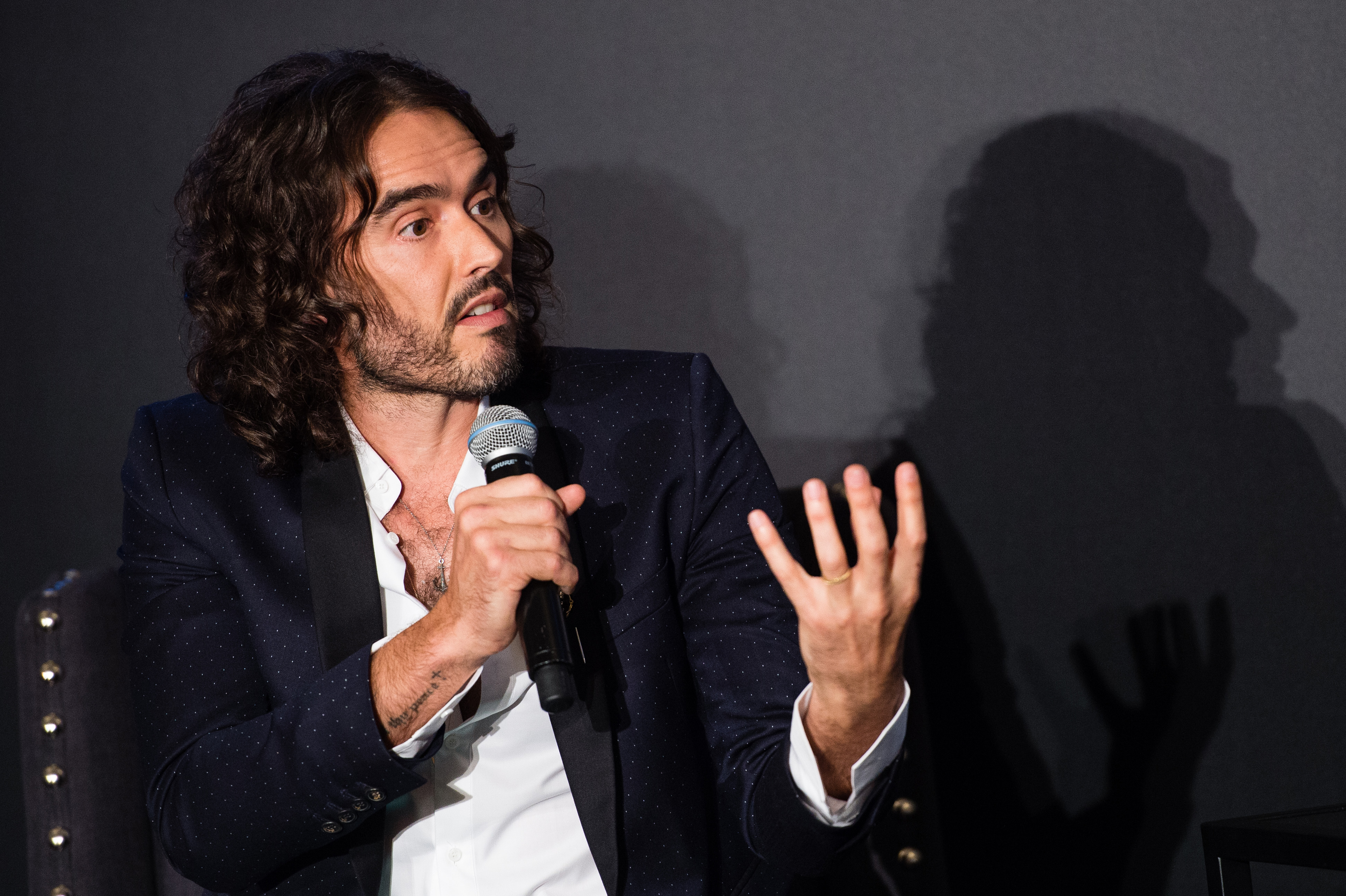 Comedian Russell Brand charged by UK police with rape and sexual assault