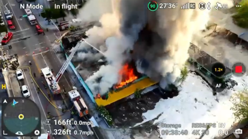 Crews were battling a massive fire at an abandoned building in Miami Friday morning.