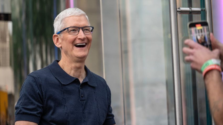Tim Cook, chief executive officer of Apple Inc., greets customers during the first day of in-store sales of Apple’s latest products at Apple’s Fifth Avenue store in New York, US, on Friday, Sept. 20, 2024.