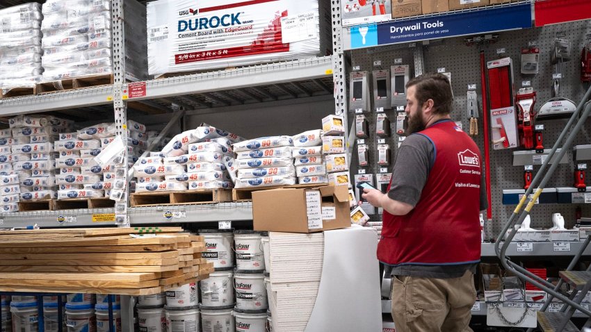 A worker helps to stock merchandise at a Lowe’s home improvement store on Feb. 26, 2025 in Chicago, Illinois.