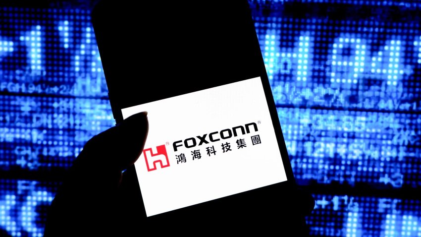 In this photo illustration, a Foxconn logo is seen displayed on a smartphone.