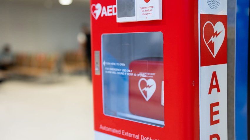 An Automated External Defibrillator, (AED) placed on the wall in public locations.