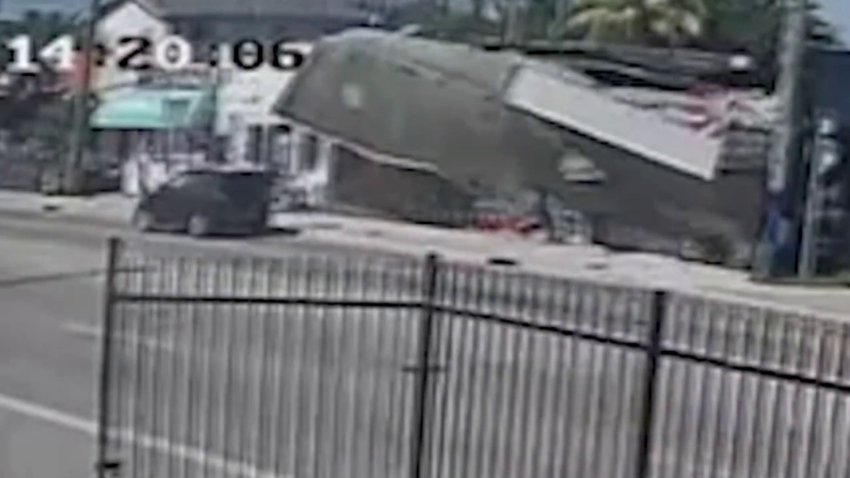 Video shows partial roof collapse in Miami narrowly miss vehicle