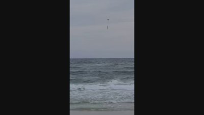 RAW: Drone drops floatation device for girl struggling at beach in Pensacola