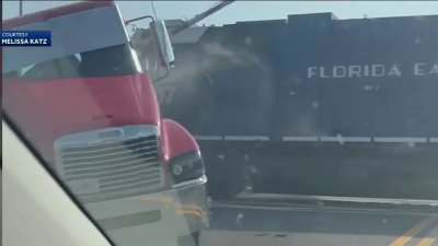 Video shows driver narrowly escaping before train hits semi-truck in Florida