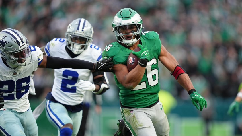 Eagles running back Saquon Barkley carries the ball against Dallas Cowboys