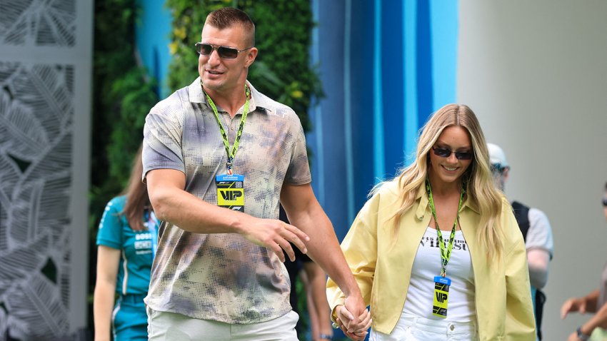 Former American football player Rob Gronkowski and his partner, Camille Kostek, arrive at the practice session for the 2025 Miami Formula One Grand Prix at Miami International Autodrome in Miami Gardens, Florida, on May 2, 2025. (Photo by CHARLY TRIBALLEAU / AFP) (Photo by CHARLY TRIBALLEAU/AFP via Getty Images)