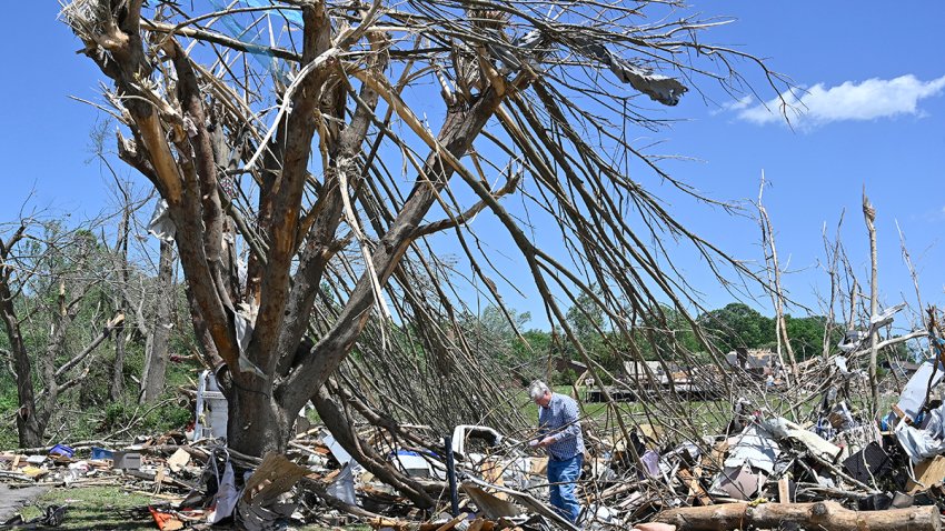 Dennis Clark goes through the remains of his house that was destroyed by severe weather in London, Ky., Saturday, May 17, 2025.