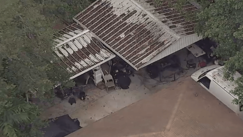 A Miami home where authorities say a chop shop operation was busted.