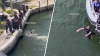 Unconscious woman found floating in Miami River, person detained: Police