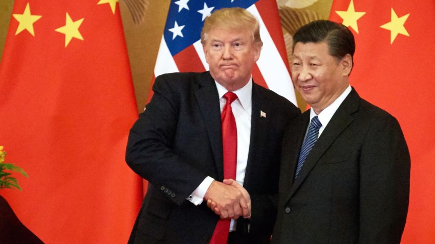 President Donald Trump and China’s President Xi Jinping shake hands at a press conference following their meeting at the Great Hall of the People in Beijing.