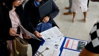 Job seekers at a job fair hosted by the Metropolitan Washington Airports Authority to support federal workers looking for new career opportunities, at Ronald Reagan Washington National Airport in Arlington, Virginia, on April 25, 2025.