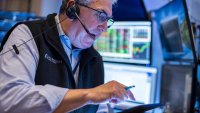 Traders work on the floor of the New York Stock Exchange on June 3, 2025.