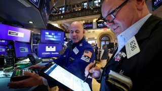 Traders work on the floor at the New York Stock Exchange (NYSE) in New York City, U.S., June 5, 2025.