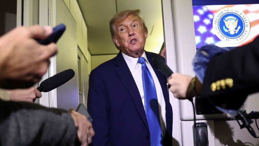 U.S. President Donald Trump speaks to reporters aboard Air Force One after departing early from the the G7 summit in Canada to return to Washington, June 17, 2025.