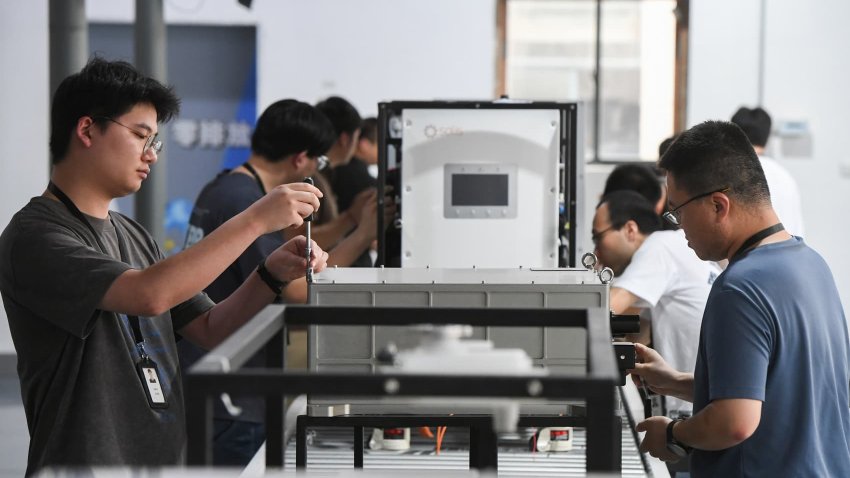 Employees work on the production line of hydrogen fuel cells at a workshop of Panxing Technology (Zhejiang) Co., Ltd. on June 23, 2025 in Jinhua, Zhejiang Province of China.