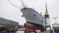 USNS Harvey Milk departs the General Dynamics NASSCO shipyard after a ceremonial address in San Diego, Calif., on Nov. 6, 2021.