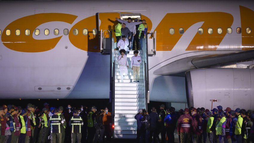 Deported individuals from the US arrive on a flight at Simon Bolivar International Airport (CCS) in Maiquetia, Vargas state, Venezuela, early on Monday, March 24, 2025