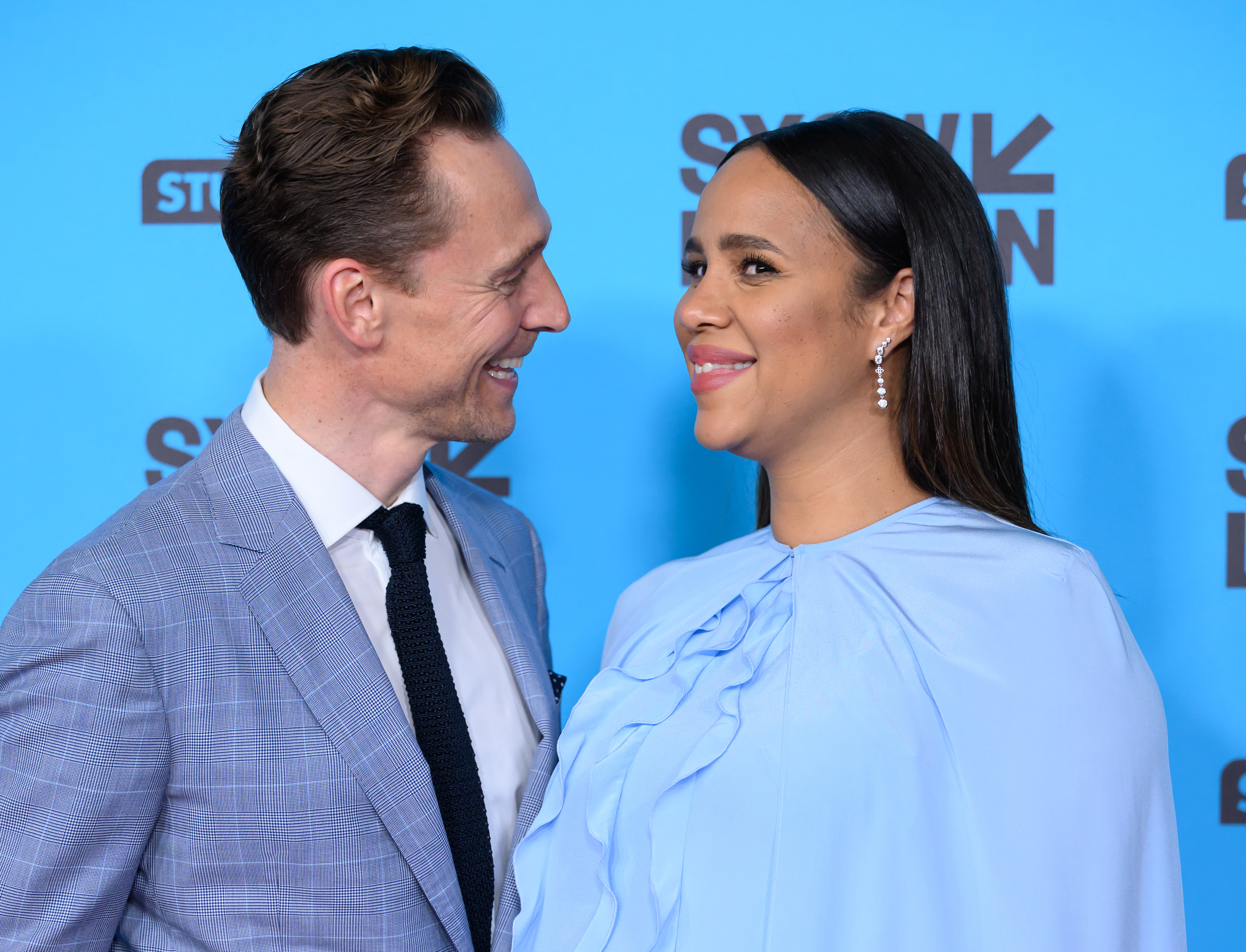 Tom Hiddleston and Zawe Ashton are expecting their 2nd child! See her baby bump debut
