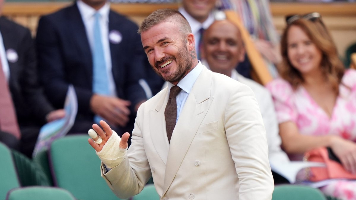 David Beckham reveals injured hand and finger at Wimbledon after being released from hospital