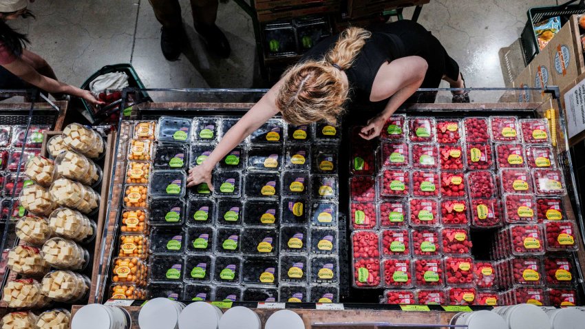People shop for groceries at a store in New York City, U.S., July 15, 2025.