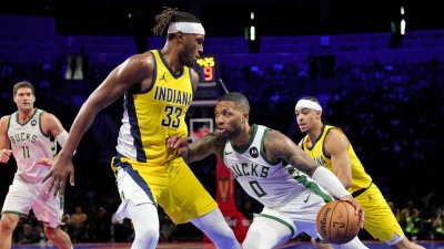 Damian Lillard drives against Myles Turner