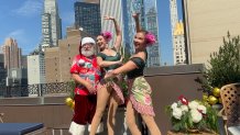 Santa and dancers perform at the Plaza Hotel