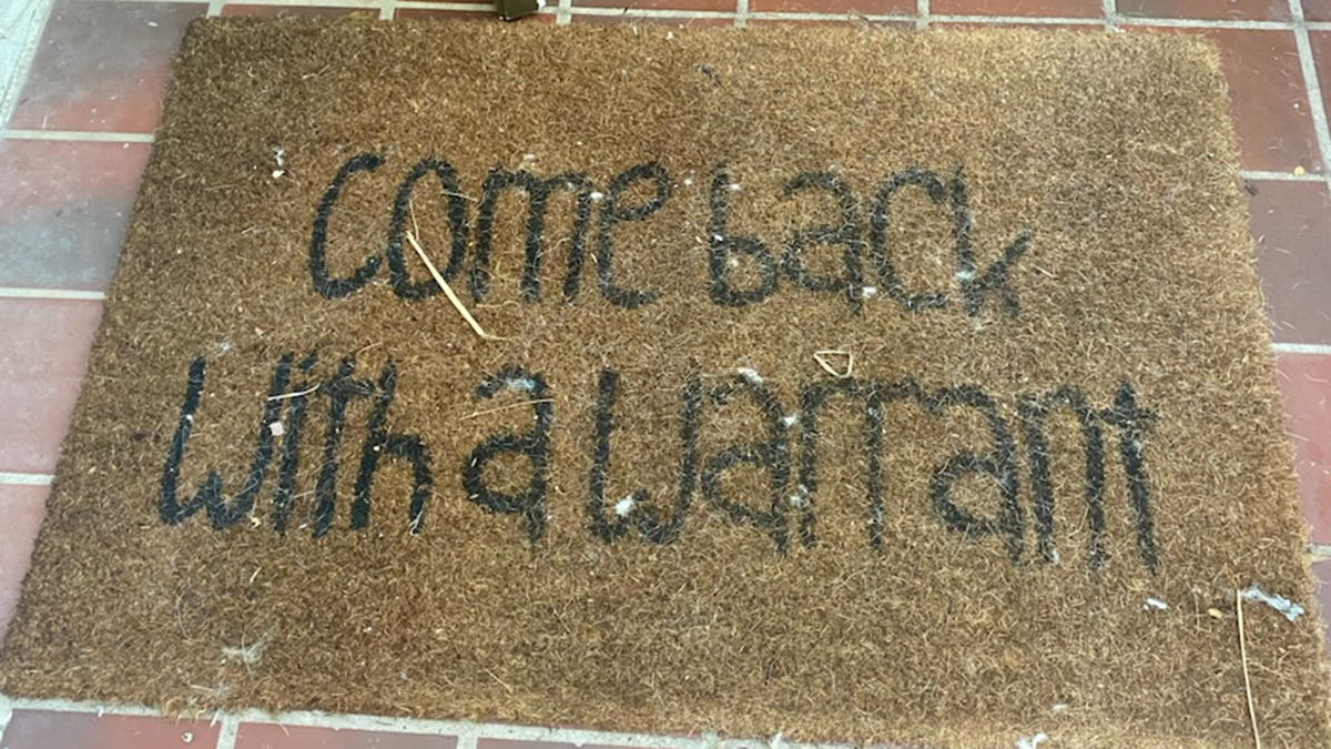 Florida man with ‘come back with a warrant' doormat arrested in fraud scheme: Sheriff