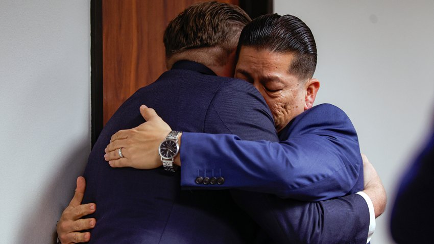 Former Uvalde school district police officer Adrian Gonzales, right, embraces his attorney Jason Goss after the jury found Gonzales not guilty at the Nueces County Courthouse on Wednesday, Jan. 21, 2026, in Corpus Christi, Texas.