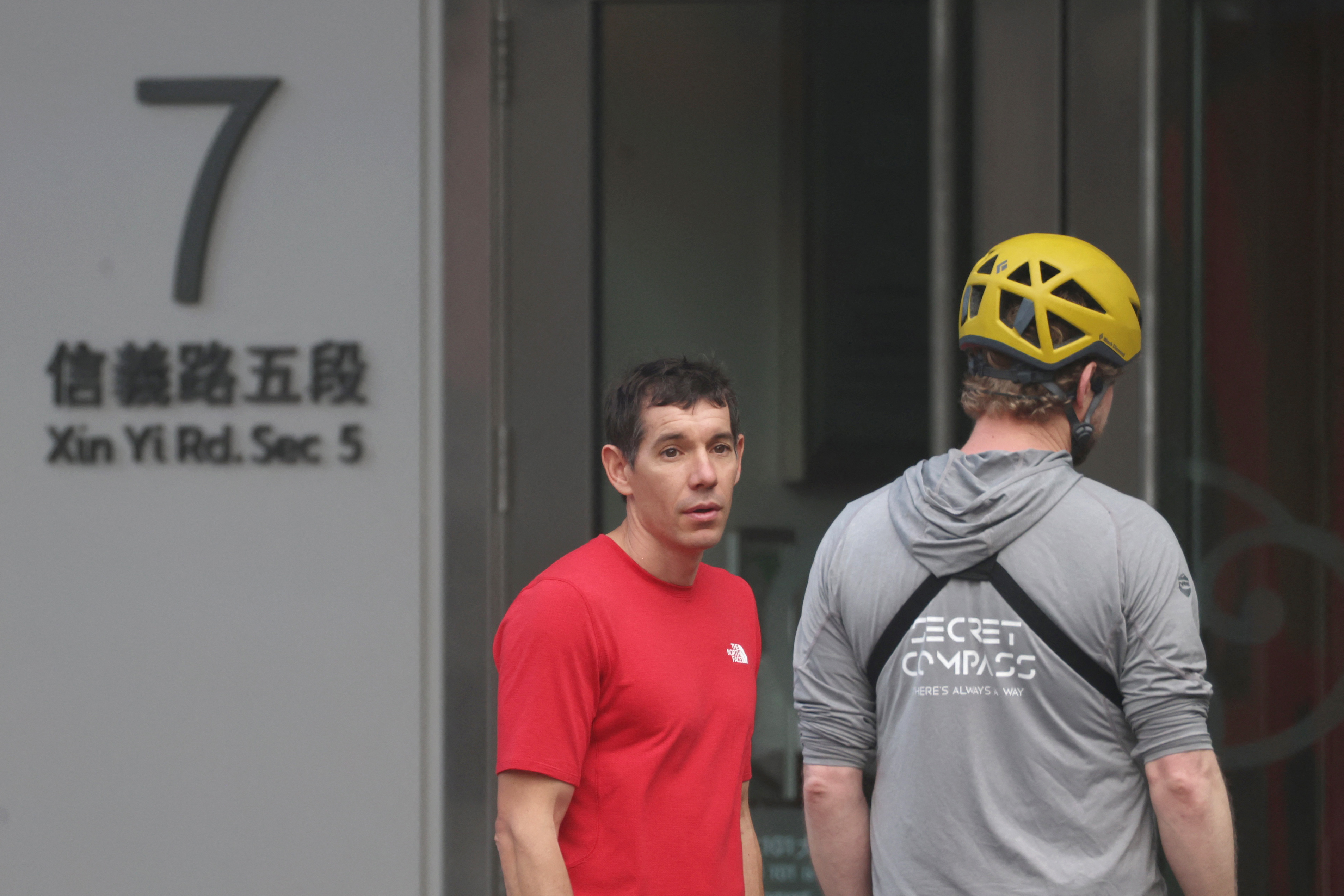 Alex Honnold's rope-free climb up Taipei 101 skyscraper underway after weather delay