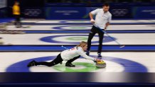 Team USA curlers Cory Thiesse and Korey Dropkin compete in the curling mixed doubles round robin semi-final between USA and Italy at the Milan Cortina 2026 Winter Olympic Games at the Cortina Curling Olympic Stadium in Cortina d'Ampezzo on February 9, 2026.