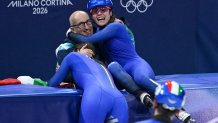 Elisa Confortola celebrates with team members
