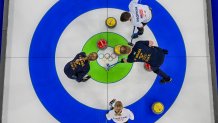 Team Sweden competes with Team USA in curling