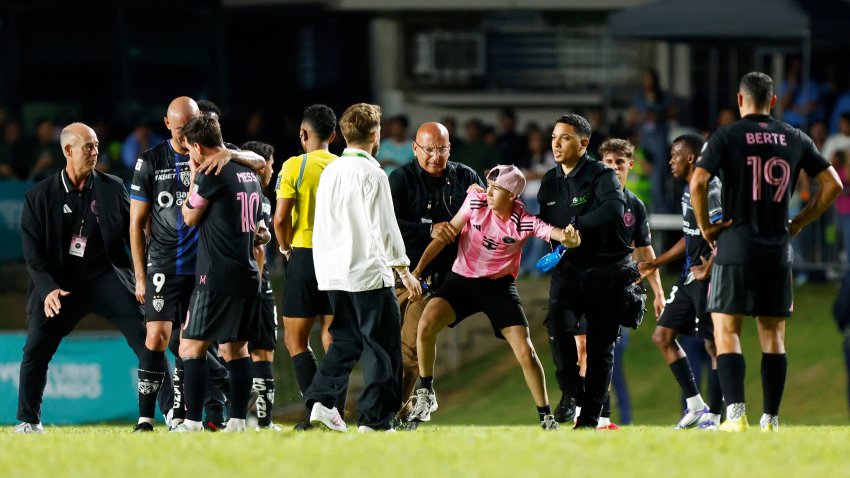 BAYAMON, PUERTO RICO – FEBRUARY 26: A kid is detained by security guards after jumping onto the field to greet Lionel Messi during a friendly game between Independiente del Valle and Inter Miami at Juan Ramón Loubriel stadium on February 26, 2026 in Bayamon, Puerto Rico. (Photo by Leopoldo Smith/Getty Images)