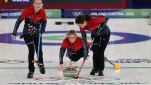 Women's curling team in action