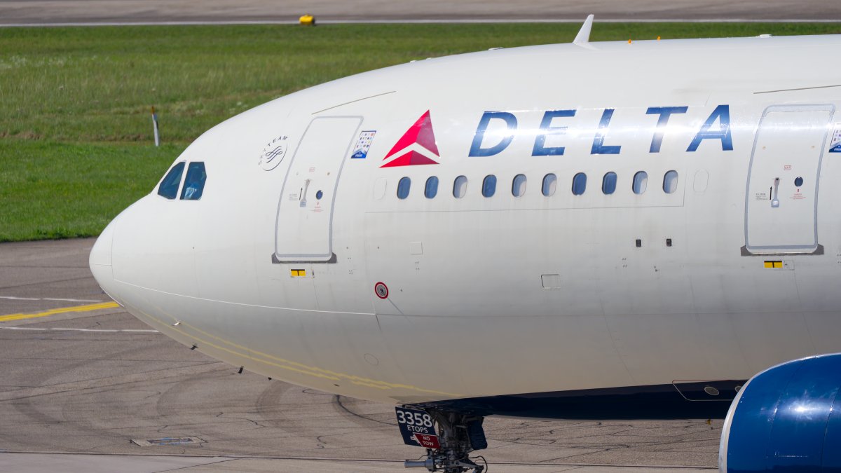 Delta airplane at airport gate