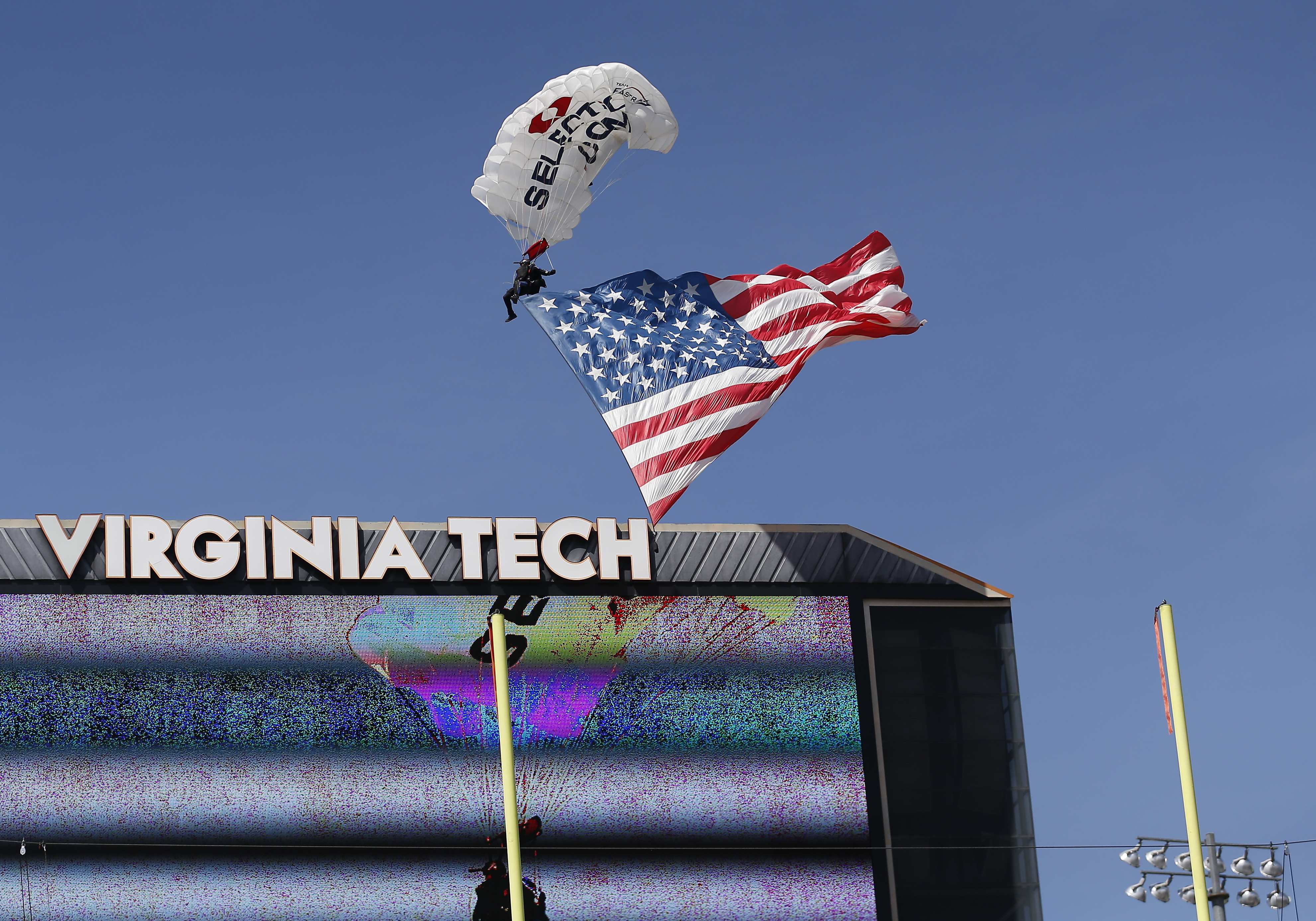 Skydiver gets rescued after crashing into scoreboard before Virginia Tech spring game