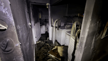 A photo provided by Miami Fire Rescue shows what appears to be a laundry room charred beyond recognition after a fire in Liberty City on March 31, 2026.