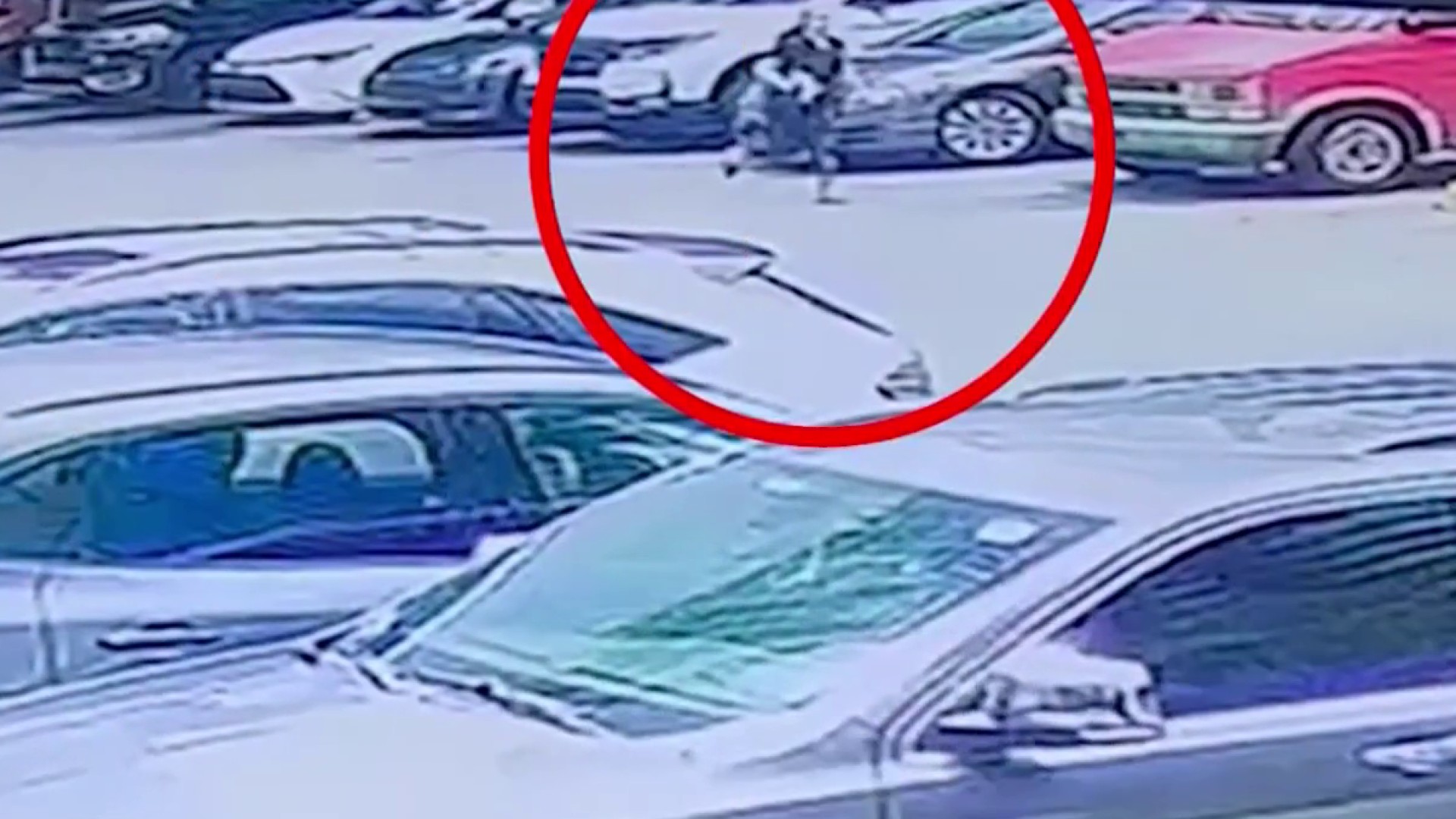 Surveillance shows woman chasing after SUV that hit her car in Brickell