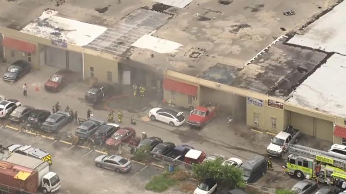 Person hospitalized after vehicle catches fire in Hialeah Gardens warehouse